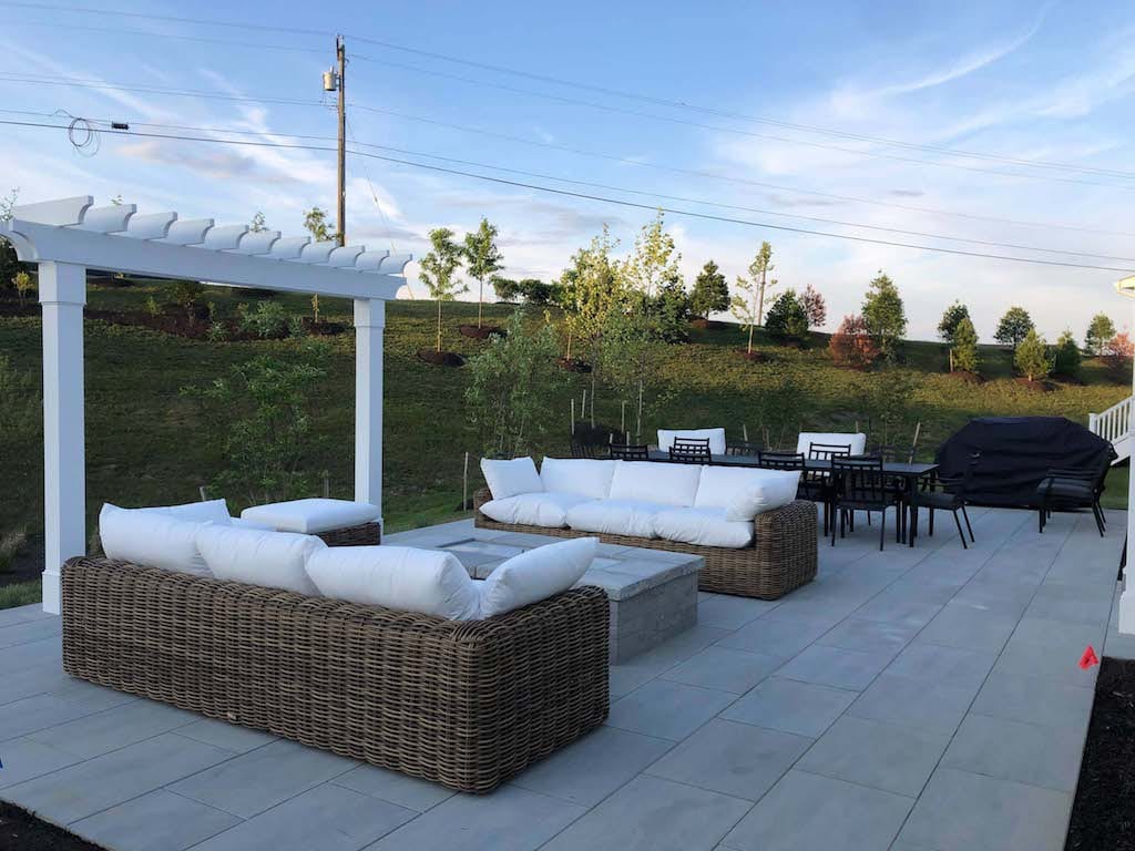 Outdoor Living Area on paver patio with pergola and outdoor furniture