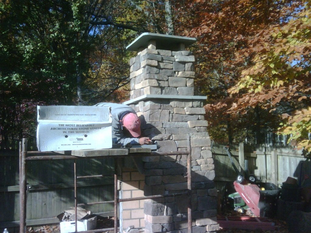 outdoor living area, exterior fireplace construction