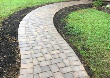 Paver front walkway Glossy finish, wet look paver sidewalk s-shape leading to home
